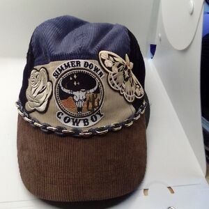 Hand Crafted Brown and Black Hat with Decorative Emblem